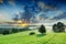 Idyllic view, foggy green fields at sunrise