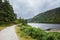 Idyllic view in Glendalough Valley, County Wicklow, Ireland. Mountains, lake and tourists walking paths