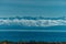 Idyllic view on Issyk-Kul lake with mountains and clouds, Kyrgyzstan