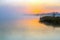 Idyllic View of Morning Fog over Lake and rising Sun