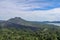 An idyllic view to the top of Mount Batur and the Danau Batur lake. There is a pathway along Batur volcano`s rim. Volcanic