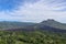 An idyllic view to the top of Mount Batur and the Danau Batur lake. There is a pathway along Batur volcano`s rim. Volcanic