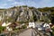 Idyllic view at the village Essing in Bavaria, Germany with the Altmuehl river, high rocks in background and a wooden bridge in