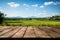 Idyllic view Wooden floor, green rice fields, and expansive blue sky