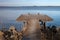 Idyllic View Of The Wooden Pier With Simple Bench