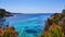 Idyllic vista of Cala Ratjada, Mallorca, featuring a serene turquoise body of crystal-clear water