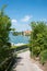 Idyllic walkway with stunning view to lake tegernsee and castle, upper bavaria