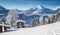 Idyllic winter landscape in the Alps with mountain lodge