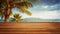 Idyllic wooden board surrounded by panoramic summer sea and palm tree.