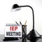 IEP MEETING text on notebook with pen and table lamp on the black background