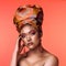 If the crown fits, wear it. Studio shot of an attractive young woman wearing a traditional African head wrap posing