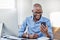 If your work is trending online, youve made it. a businessman using his cellphone while sitting at his desk.