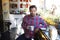 If youre not shaking, you need another cup. a young man holding a cup of coffee in a cafe.