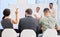 If youre unsure, feel free to ask questions. Rearview shot of a group of businesspeople attending a conference meeting