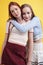 ifestyle people concept: two pretty young school teenage girls having fun happy smiling on yellow background