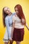 ifestyle people concept: two pretty young school teenage girls having fun happy smiling on yellow background