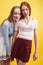 ifestyle people concept: two pretty young school teenage girls having fun happy smiling on yellow background