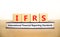 IFRS symbol. Concept words IFRS international financial reporting standards on block on beautiful white background. Business IFRS