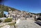 Igiades village on the mountain mitsikeli, greek fllag waving old traditional houses in ioannina