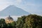 Iglesia de la Merced with volcano Agua and raven in haze Antigua Guatemala