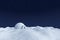 Igloo icehouse on snow polar field under night sky with stars.