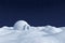 Igloo icehouse on snow polar field under night sky with stars