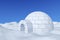 Igloo icehouse under blue sky