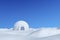 Igloo icehouse under winter blue sky