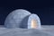 Igloo icehouse with warm light inside under night sky with stars
