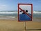 Ign at the beach with man swim and not symbol, Caution No Swimming allowed