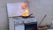 Igniting fire with a blow torch, kitchen fire demonstration