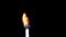 Igniting match and flame on a black background