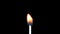 Igniting match and flame on a black background. Slow motion
