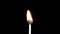 Igniting match and flame on a black background. Slow motion