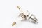 Ignition spark plug with platinum electrode. Automotive parts isolated above white background