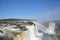 Iguazu waterfalls rainbow on sunny