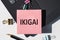 IKIGAI. The word Ikigai on note stickers lying on laptop. IKIGAI is a Japanese concept reason for being of life purpose