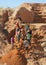 Ilakaka, Madagascar - April 30, 2019: Group of unknown Malagasy men mining sapphire in surface mine, by moving ground with shovels