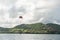 ILE AUX CERFS, MAURITIUS - OCTOBER 06, 2015: Water entertainment with ycht and parachute above the water. Mauritius. Deer Island