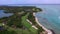 Ile aux Cerfs Privately Owned Island Beach in Mauritius. Golf field and Coastline in background