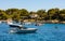 Ile Saint Honorat island panorama with forest coast and yachts on Mediterranean Sea waters offshore Cannes in France