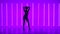 Ilhouette of a young woman in full growth dancing elements of modern dance in the studio against a background of