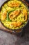 Ilish Pulao Bengali Style Hilsa Fish Pilaf closeup on the plate. Vertical top view