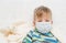 Ill little boy in medicine health-care mask