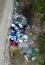 Illegal dump near country road, drone view. Junk pollution in nature