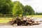 Illegal fly tipping and dumping of waste, with a sign saying `No fly tipping` in the background. Hertfordshire. UK.