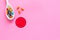 Illness. Drug intake. Pills in spoon near sad face emoji on pink background top view space for text