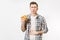 Illness sad young man in shirt put hand on pain abdomen, stomach-ache, standing and holding burger isolated on white