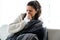 Illness young woman sneezing in a tissue.