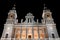 Illuminated Almudena Cathedral facade in Madrid, Spain